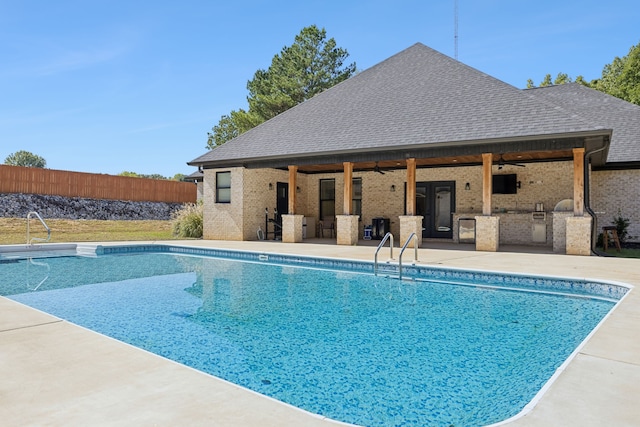 view of pool with a patio area and ceiling fan