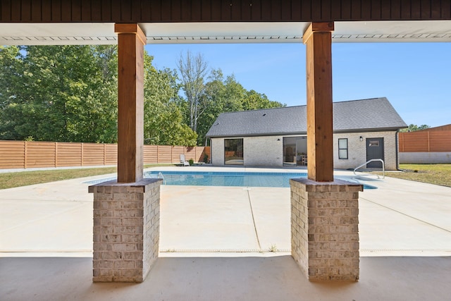 view of swimming pool with a patio area