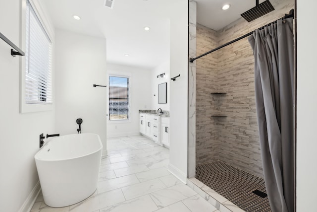 bathroom featuring vanity and plus walk in shower