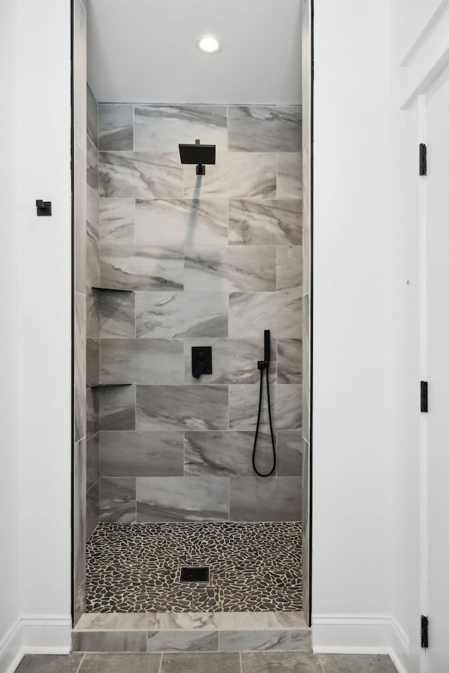 bathroom with tiled shower