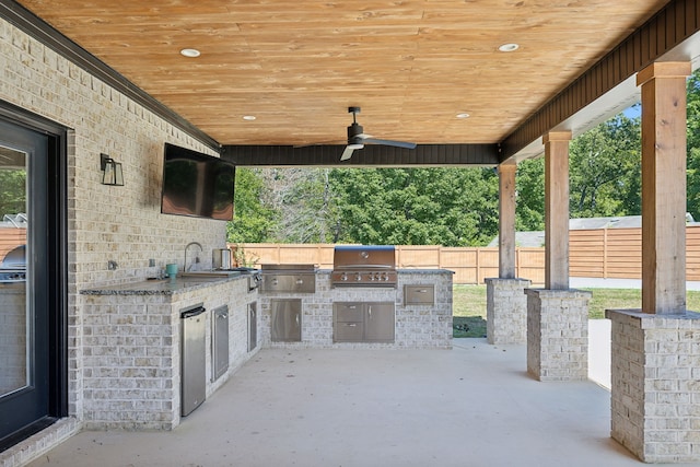 view of patio with area for grilling, grilling area, sink, and ceiling fan