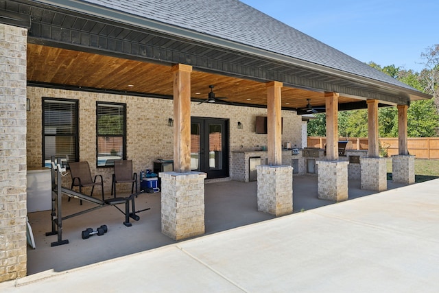 view of patio with french doors, ceiling fan, and area for grilling