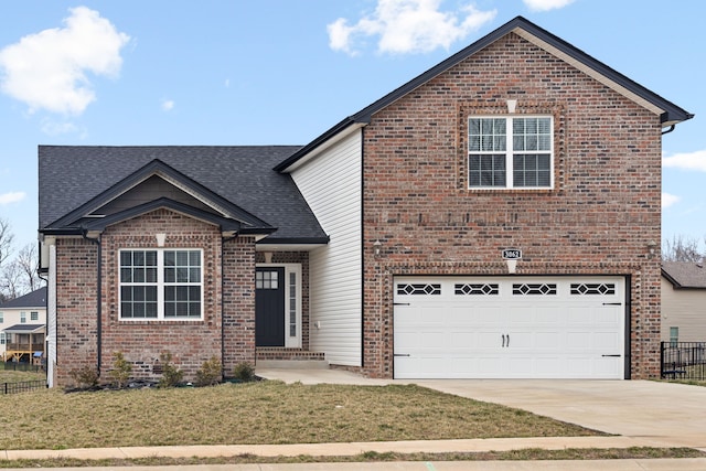 front facade featuring a front yard and a garage