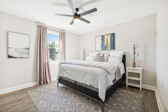 bedroom featuring dark wood-type flooring and ceiling fan