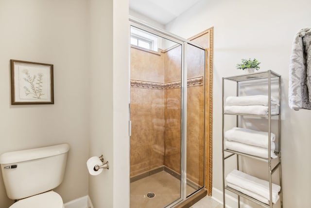 bathroom with toilet and walk in shower