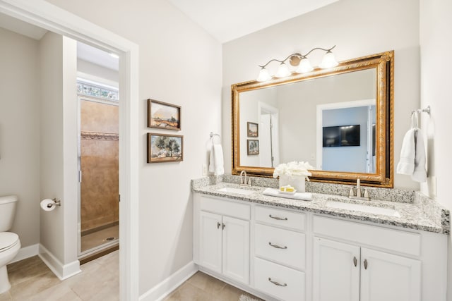 bathroom featuring toilet, walk in shower, vanity, and tile patterned flooring