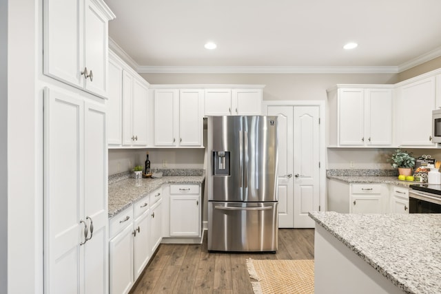 kitchen featuring light stone counters, white cabinetry, light wood-type flooring, crown molding, and stainless steel appliances