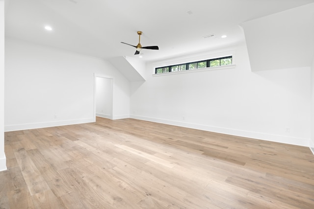 additional living space with light wood-type flooring and ceiling fan