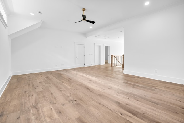 unfurnished living room with ceiling fan, crown molding, and light hardwood / wood-style flooring