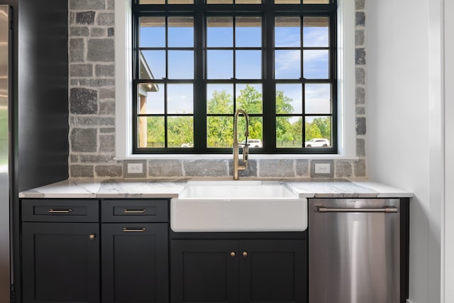 bar featuring stainless steel dishwasher, sink, and a healthy amount of sunlight