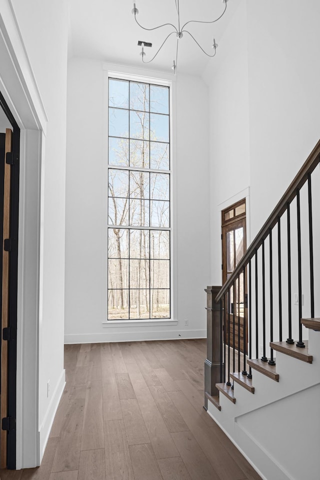 5104 Cobbler Ridge Ct, Franklin, TN 37064 - entrance foyer featuring stairway, plenty of natural light, an inviting chandelier, and wood finished floors