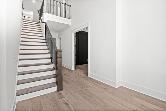 5104 Cobbler Ridge Ct, Franklin, TN 37064 - stairs with baseboards, a towering ceiling, and wood finished floors