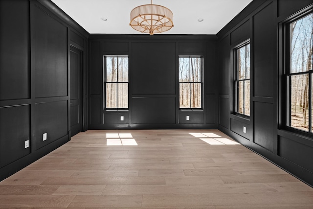 5104 Cobbler Ridge Ct, Franklin, TN 37064 - unfurnished room featuring light wood-type flooring, a decorative wall, and plenty of natural light