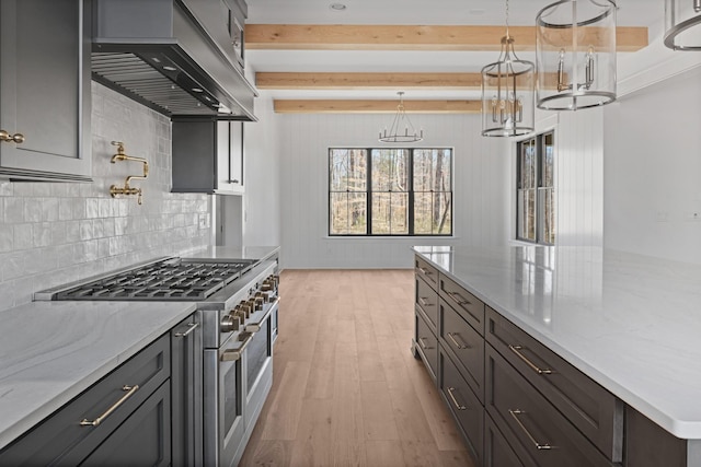 5104 Cobbler Ridge Ct, Franklin, TN 37064 - kitchen featuring wall chimney range hood, light wood-style flooring, light stone countertops, beam ceiling, and stainless steel range