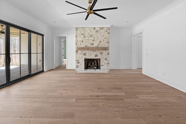 5104 Cobbler Ridge Ct, Franklin, TN 37064 - unfurnished living room featuring baseboards, a fireplace, crown molding, light wood-style floors, and ceiling fan
