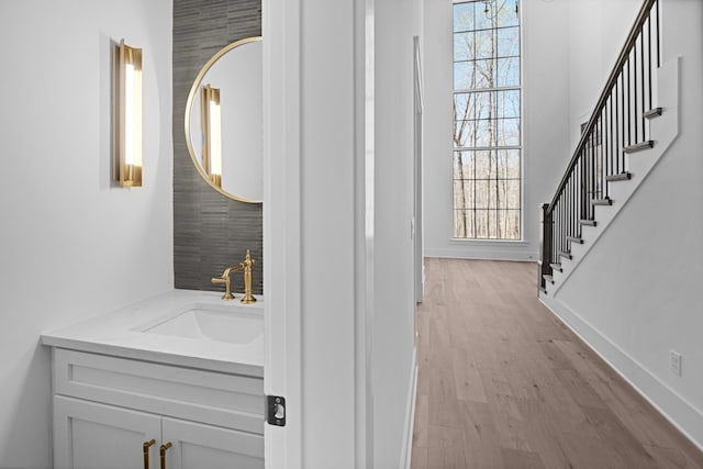 5104 Cobbler Ridge Ct, Franklin, TN 37064 - bathroom with wood finished floors, vanity, and baseboards