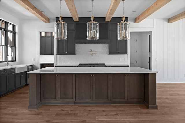 5104 Cobbler Ridge Ct, Franklin, TN 37064 - kitchen featuring a large island, light countertops, backsplash, a sink, and wood finished floors