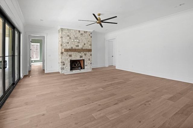 5104 Cobbler Ridge Ct, Franklin, TN 37064 - unfurnished living room with a stone fireplace, baseboards, ornamental molding, ceiling fan, and light wood finished floors