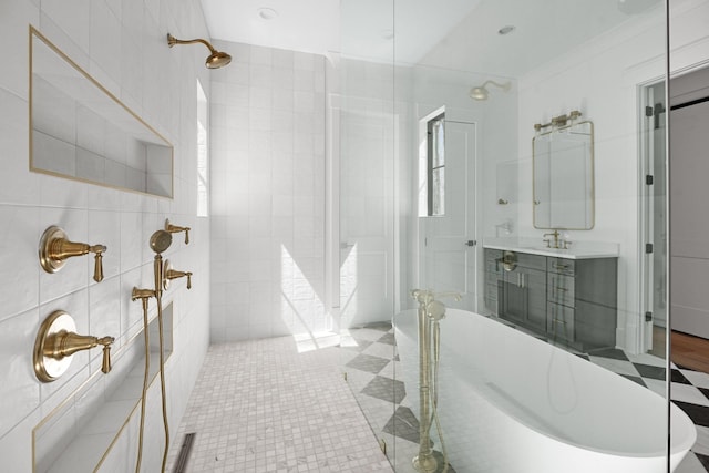 5104 Cobbler Ridge Ct, Franklin, TN 37064 - bathroom featuring a freestanding bath, tile walls, tiled shower, and vanity