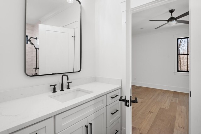 5104 Cobbler Ridge Ct, Franklin, TN 37064 - bathroom with baseboards, a ceiling fan, vanity, and wood finished floors