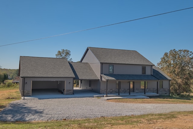 view of front facade with a porch and a garage