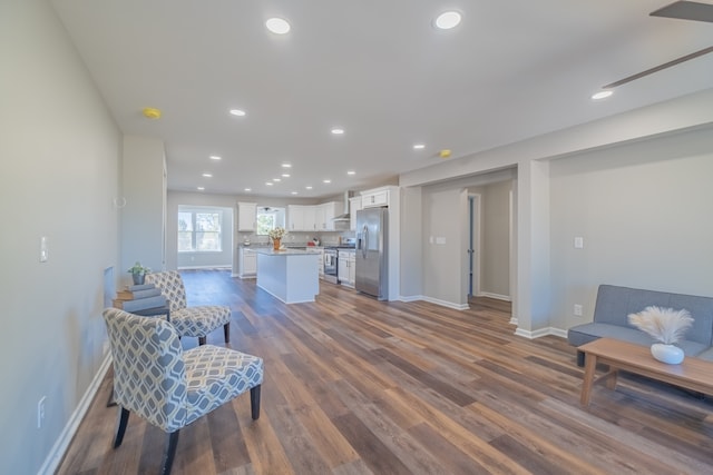 interior space with ceiling fan and dark wood-type flooring