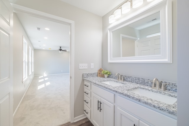 bathroom with ceiling fan and vanity