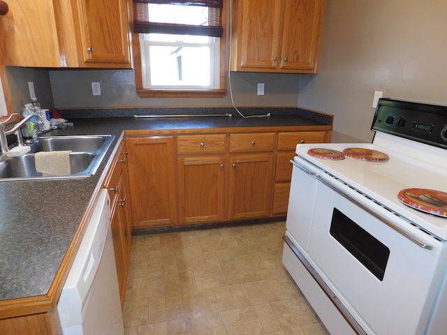 kitchen featuring white appliances and sink