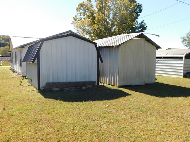 view of outdoor structure featuring a lawn