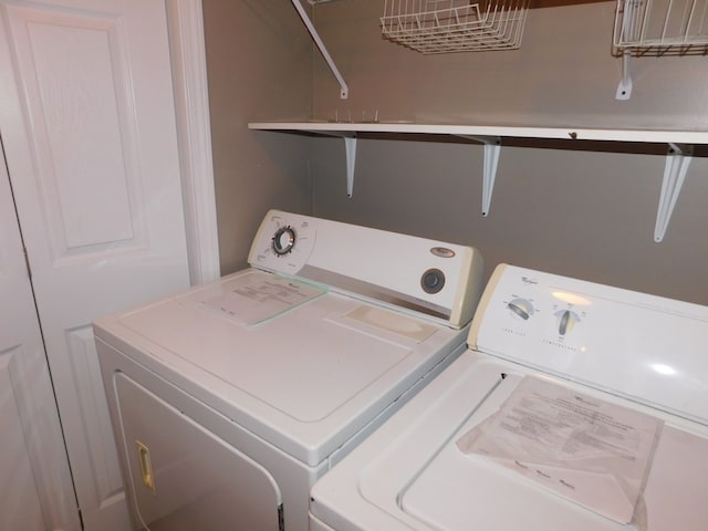 laundry room with separate washer and dryer