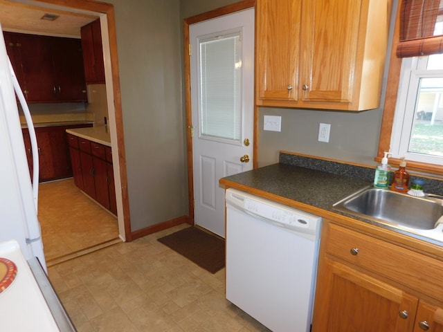 kitchen featuring sink and white appliances