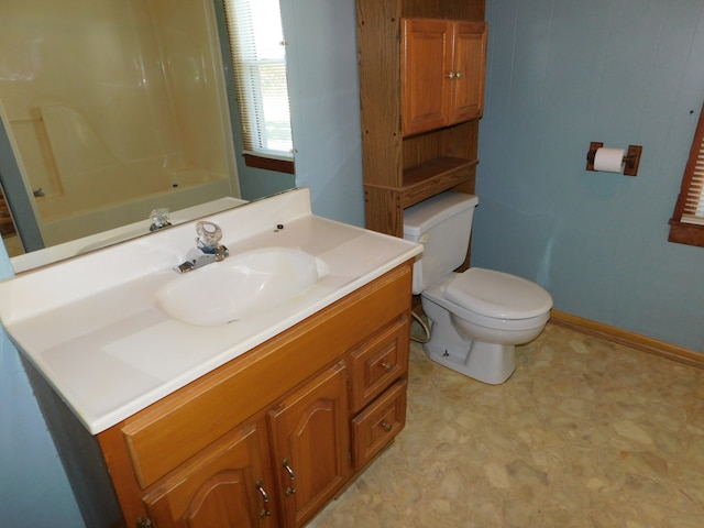 full bathroom featuring vanity, toilet, and  shower combination