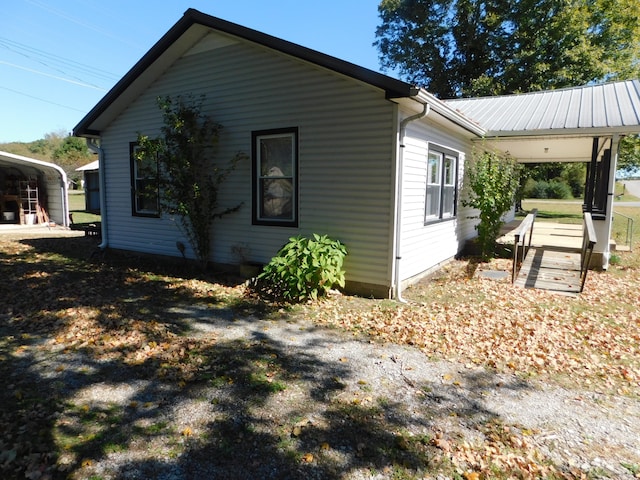 view of property exterior with a carport