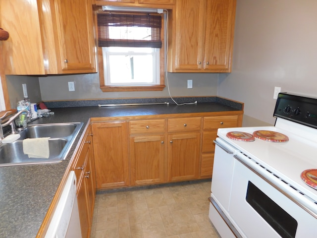 kitchen featuring white appliances and sink