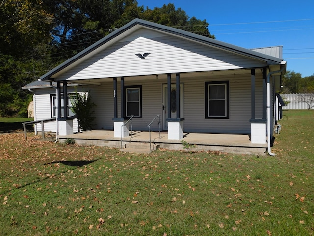 view of front facade with a porch and a front lawn