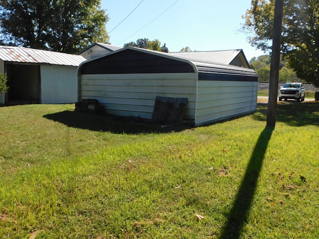 view of outdoor structure with a yard