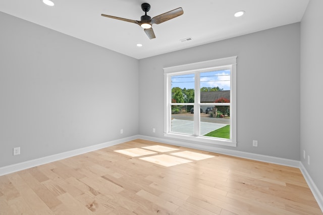 unfurnished room featuring ceiling fan and light hardwood / wood-style flooring