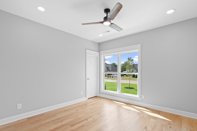 unfurnished room featuring light hardwood / wood-style flooring and ceiling fan