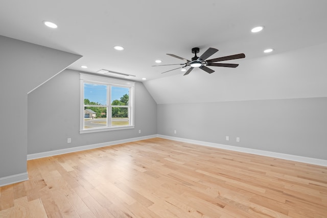 additional living space featuring light hardwood / wood-style flooring, ceiling fan, and vaulted ceiling