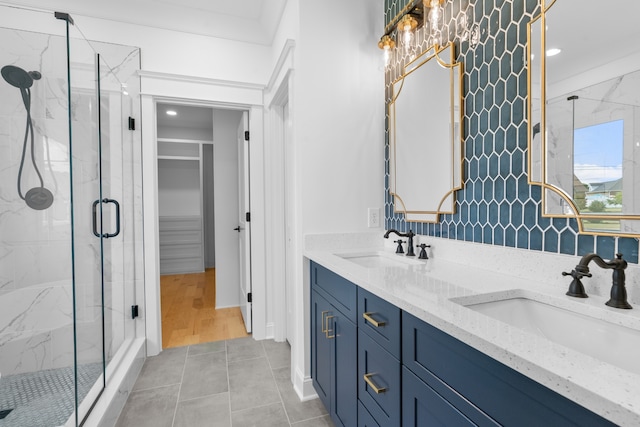 bathroom with vanity, tile patterned floors, and an enclosed shower