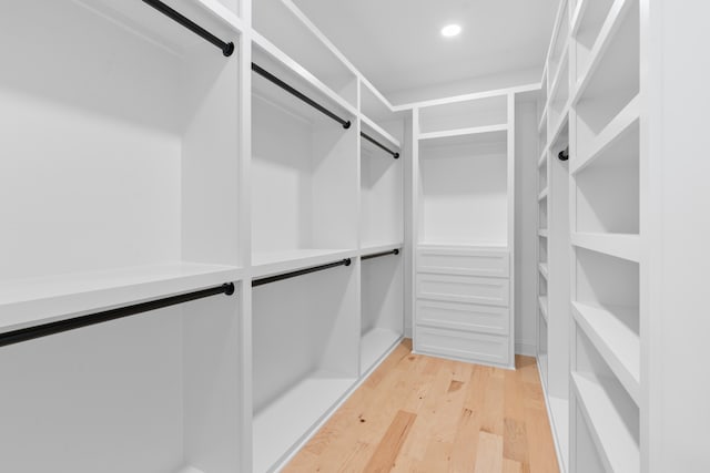 walk in closet featuring light hardwood / wood-style flooring