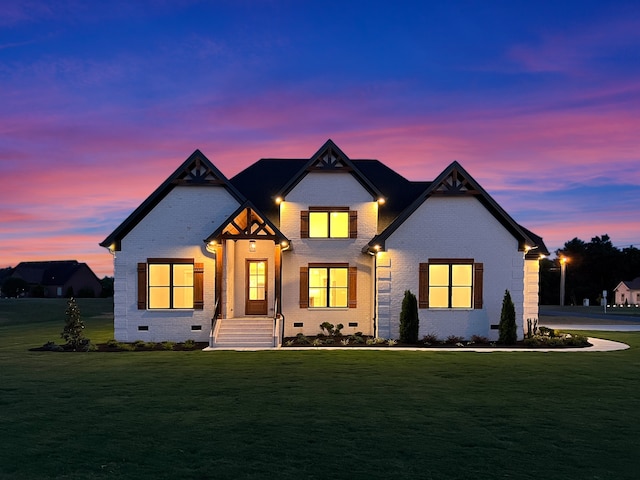 view of front of house with a lawn