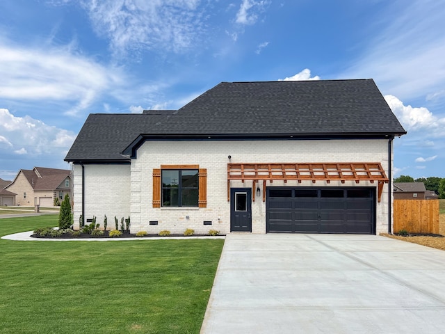 view of front of house with a front lawn and a garage