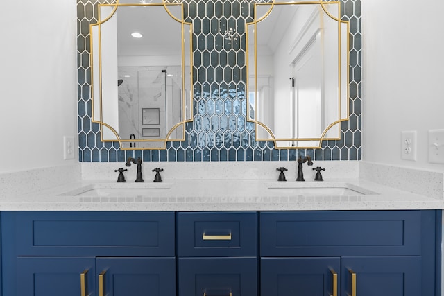 bathroom featuring vanity, decorative backsplash, and an enclosed shower