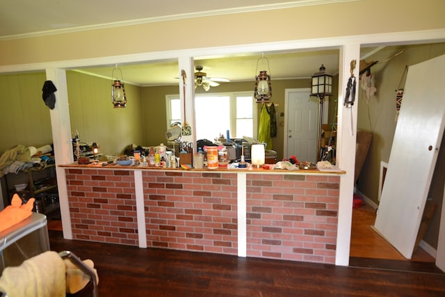 kitchen with crown molding, hardwood / wood-style floors, pendant lighting, and ceiling fan