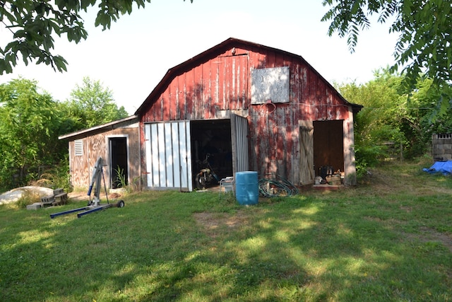 view of outbuilding featuring a yard