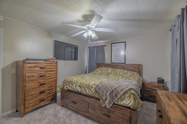 bedroom with ceiling fan and light carpet