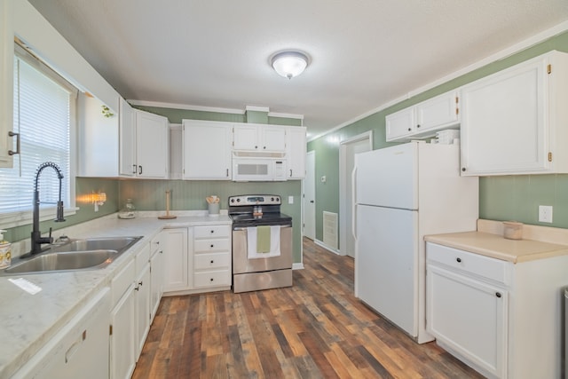 kitchen with white cabinets, dark hardwood / wood-style floors, ornamental molding, sink, and white appliances