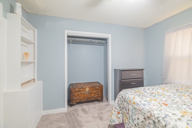 carpeted bedroom featuring a closet