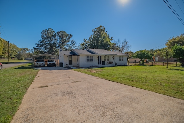 view of front facade with a front yard, a porch, and a carport